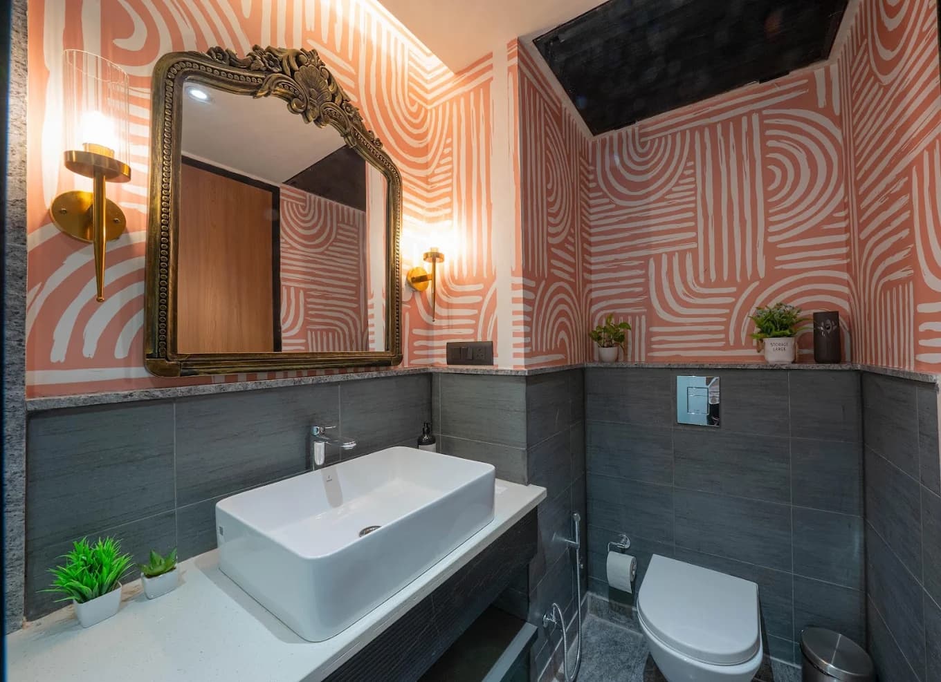 Washroom with carved brass mirror