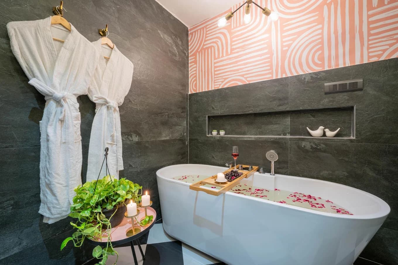 Freestanding bathtub with petals and robes